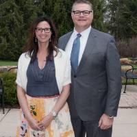 Award winner poses with wife (outdoors)